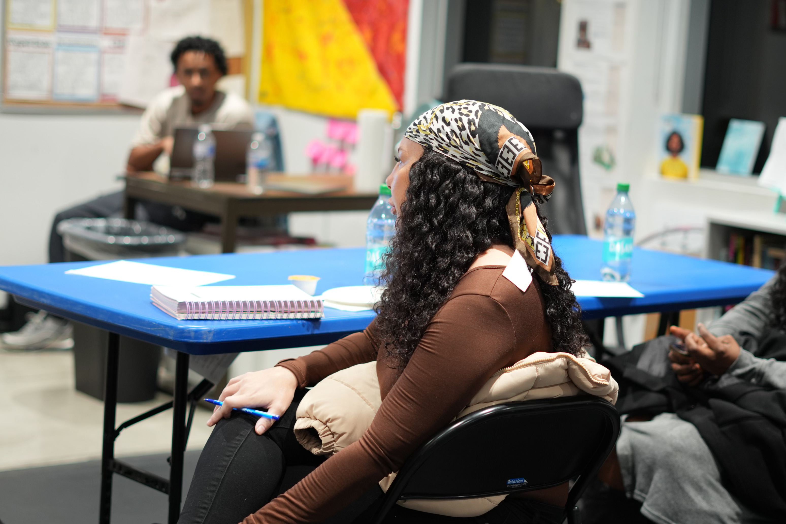 Healthcare worker writing during session